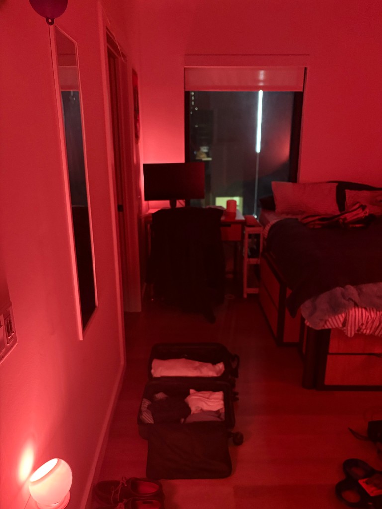 Bedroom lit red by the orb